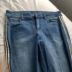 Blue jeans with black and white stripe